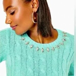 Elegant Turquoise Sweater with Embellished Neckline
